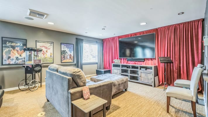 Common area with seating and entertainment setup