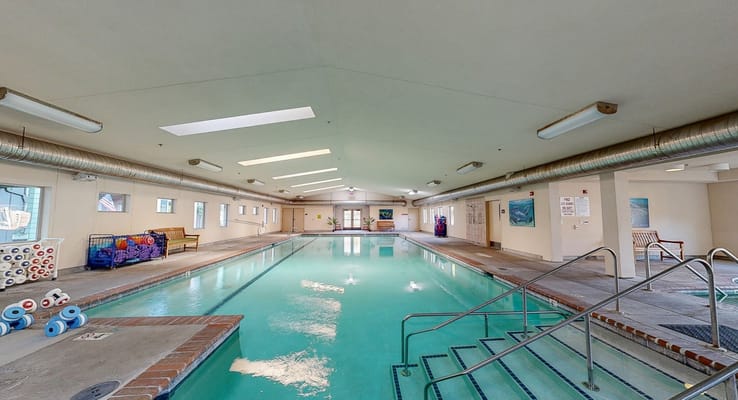 Indoor swimming pool in a brightly lit facility