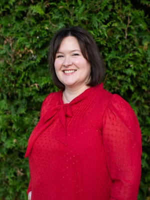 Portrait of a staff member smiling outdoors