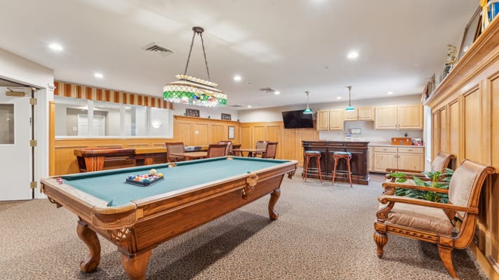 Interior view of a game room with a pool table