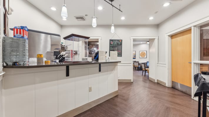 Interior view of a dining area with staff