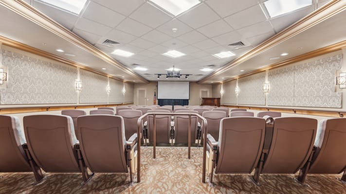 Interior view of a common area with seating and projector