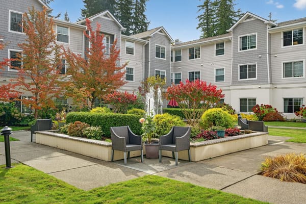 Lush outdoor garden with seating and fountain