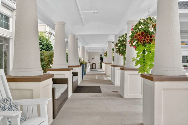 Interior hallway with decorative columns and planters