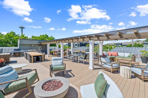 Outdoor rooftop space with seating and views