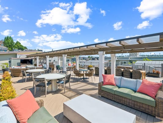 Outdoor terrace with seating and beautiful sky