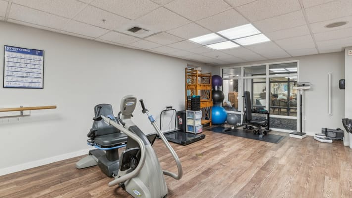 Interior view of a fitness area with exercise equipment