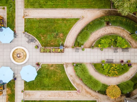 Aerial view of a landscaped courtyard with pathways and seating