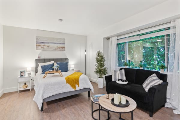 Cozy resident bedroom with natural light and décor