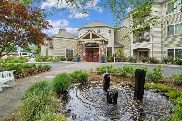 Entrance of a senior living facility with outdoor landscaping