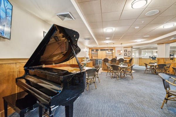 Interior view of a lounge area with a piano