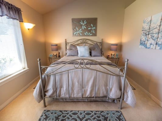 Cozy private room with bed and decor