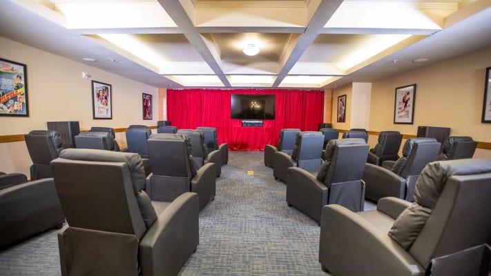 Interior of a cozy movie room with reclining seats
