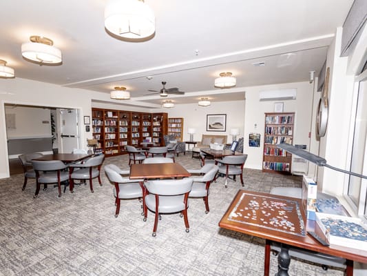 Cozy common area with seating and bookshelves