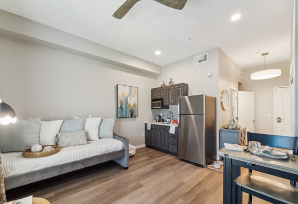 Cozy resident room with kitchenette and decor