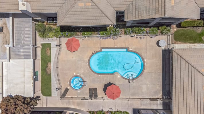 Aerial view of a pool and spa area in a senior living facility