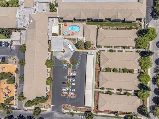 Aerial view of Cogir of Cedar Creek facility with pool and outdoor space