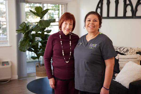 Staff member with resident in a cozy living area