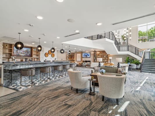 Bright common area with seating and bar