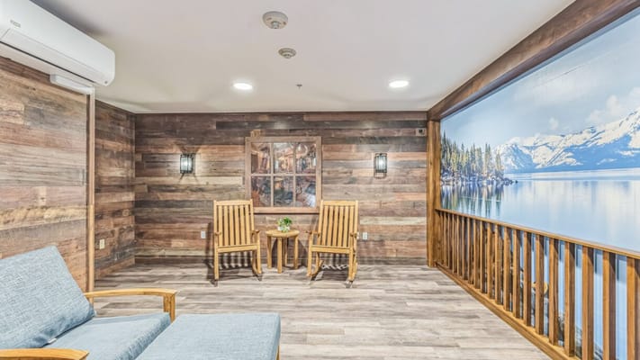 A cozy common area with wooden accents and seating