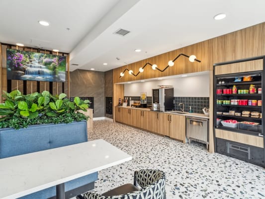 Interior view of a stylish common area with a snack bar