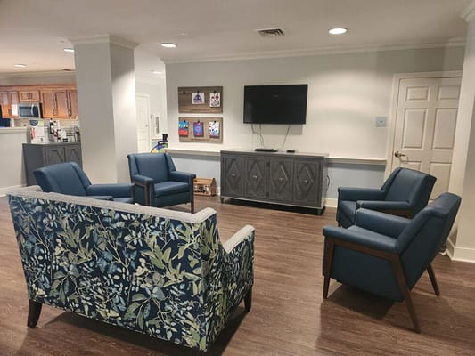 Common area with seating and television