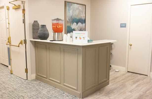 Interior drink station with decor and refreshments