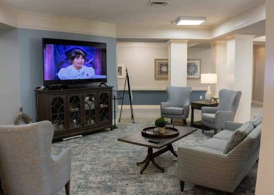 Interior lounge area with comfortable seating and a TV