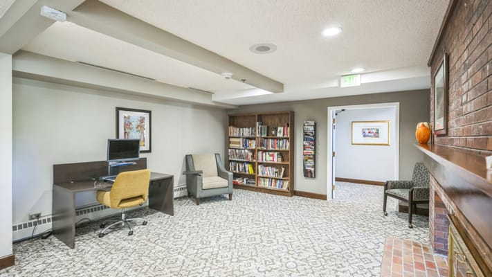 Interior view of a cozy common area with bookshelves