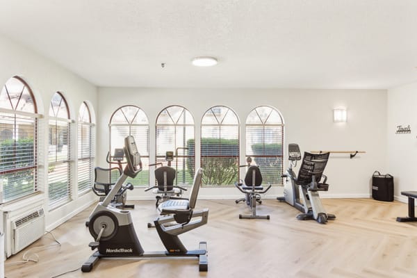 Fitness room with exercise equipment and natural light