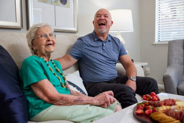 Happy interaction between a resident and a staff member