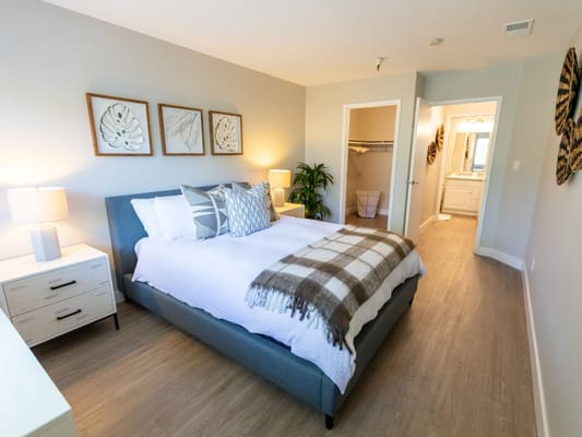 Cozy and bright resident room with a bed and decor