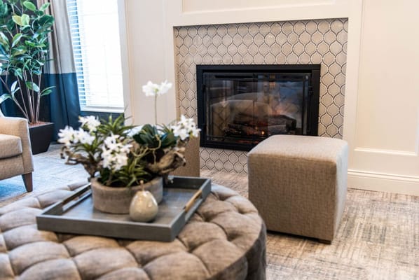 Cozy interior with a fireplace and decorative plants