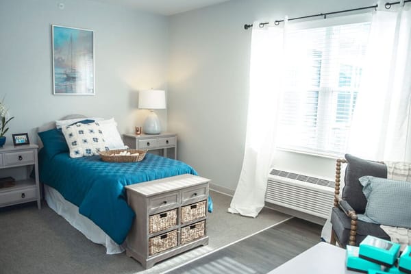 Cozy resident room with a bed and natural light