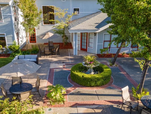 Beautiful outdoor patio area with seating and landscaping