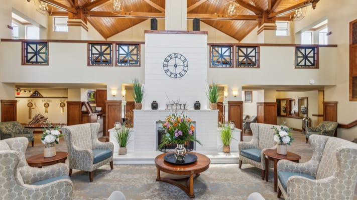 Bright common area with seating and floral decor