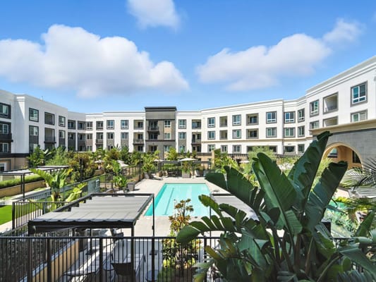 Beautiful outdoor pool area surrounded by greenery