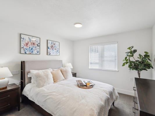 Cozy bedroom with floral decor and a bed