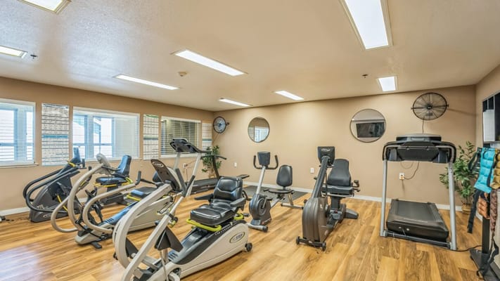 Interior view of a fitness area with exercise equipment