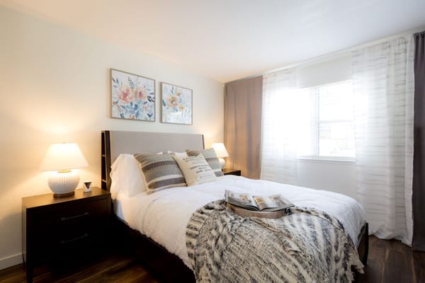 Cozy private bedroom with floral decor and natural light