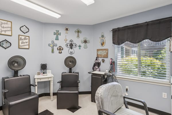 Hair salon area with styling chairs and decorations