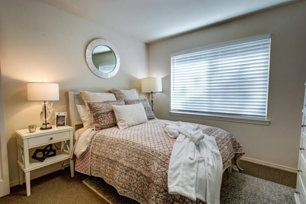 Cozy private resident room with bed and decor