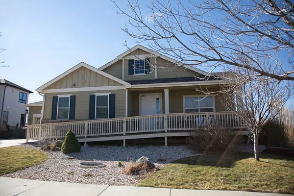 Exterior view of a assisted living facility with a porch