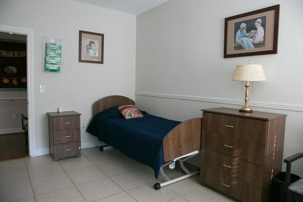 A private resident room with a bed and furniture