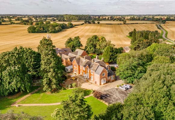 Aerial view of Hadleigh Care Home with surrounding landscape