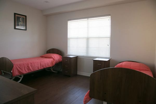 Interior view of a shared resident room with beds