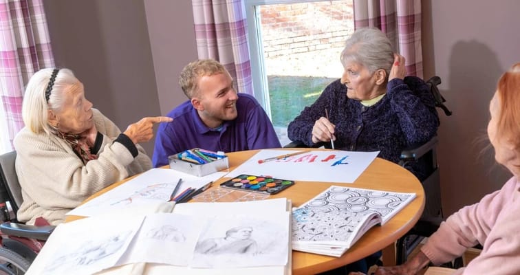Residents participating in a creative activity together