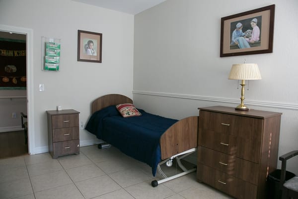 Private resident room with bed and furniture