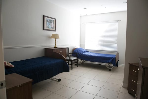 Interior view of a private resident room with beds