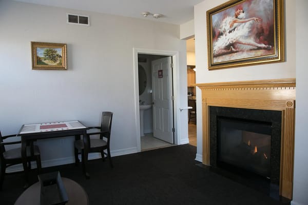 Interior view of a resident's living room with fireplace